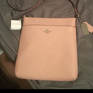 Coach crossbody bad. Brand new with tags. Beautiful blush color.